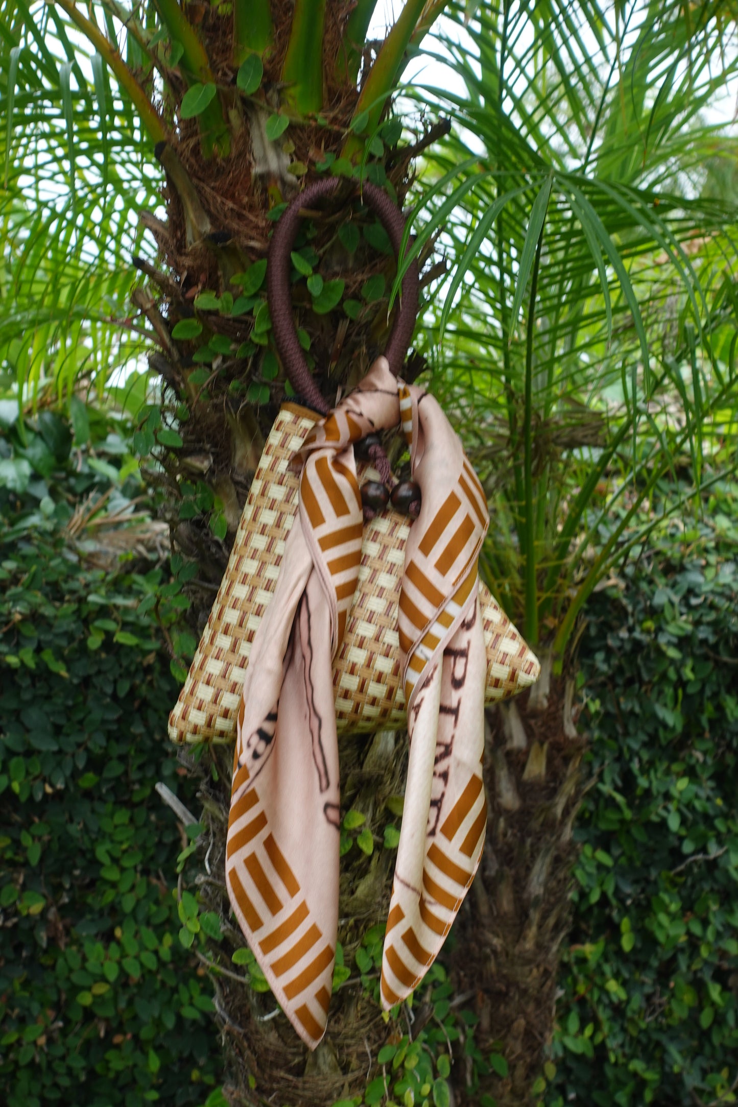 Mapa Tali Scarf tied to a bag