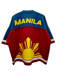 Knit Jersey in red and blue with half sun graphic and big text "manila"