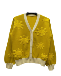Yellow cardigan with sunflower patterns on a white background