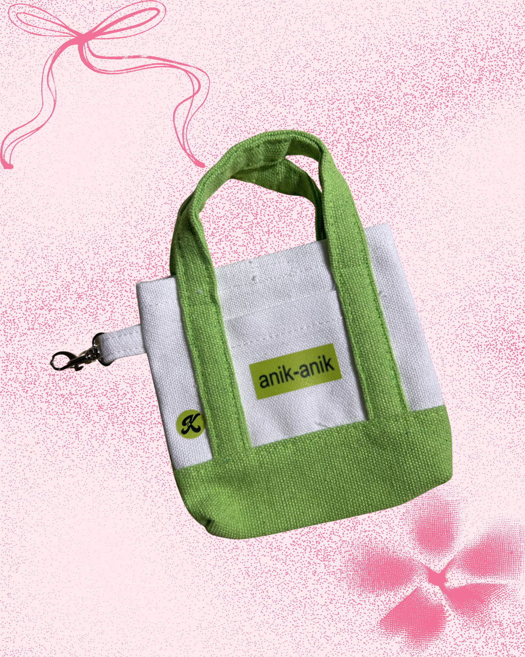 Two-toned green micro tote bag with 'anik-anik' graphic text