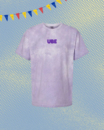 Purple tie-dye t-shirt with 'UBE' text on a blue background with colorful flags.